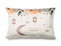 Decorative pillow with floral, lantern, and moon design featuring 'Ramadan Kareem' text.